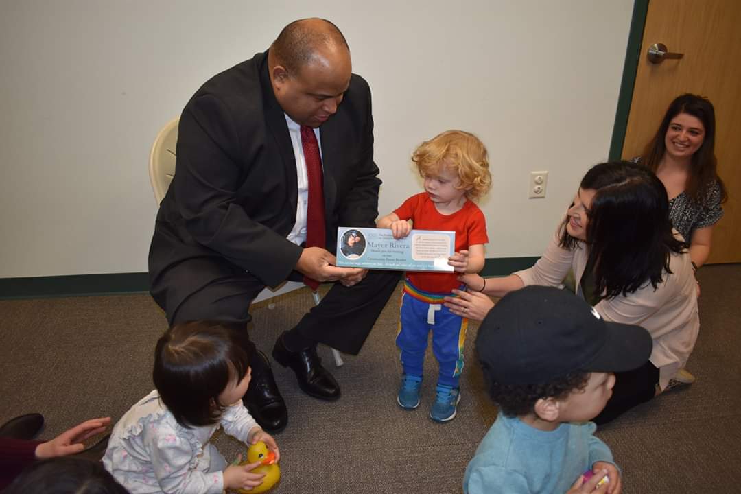 pccdMA's tweet photo. Excited to have Mayor Dan Rivera visiting us in Lawrence today! The Mayor interacted with the families in one of our parent-child toddler groups, and met with staff. #thisispccd #funwithfriends https://t.co/KNBquxYXRz @danrivera01843 @COL1853 @maaps766 https://t.co/UL9o7SYpsz
