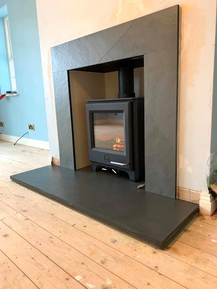 One of our favourite stoves, the Woodwarm Phoenix 
Grey slate hearth &amp; grey slate surround cut to size and fitted. 
New chimney liner installed &amp; signed off through Hetas.
For a free survey please message us or pop in to the showroom at the Tony Cook Garden Centre Skirlaugh.