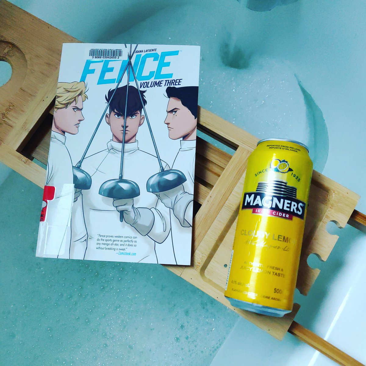 kathytrithardt's tweet photo. This week's #wednesdaytradition features Fence Volume 3 by C.S. Pacat, Johanna the Mad, and Joana Lafuente, and a Magners Cloudy Lemon Irish Cider. #bookbathandbeverage #booktuber #booksandbaths #treatyoself https://t.co/hMDNBvnyA5