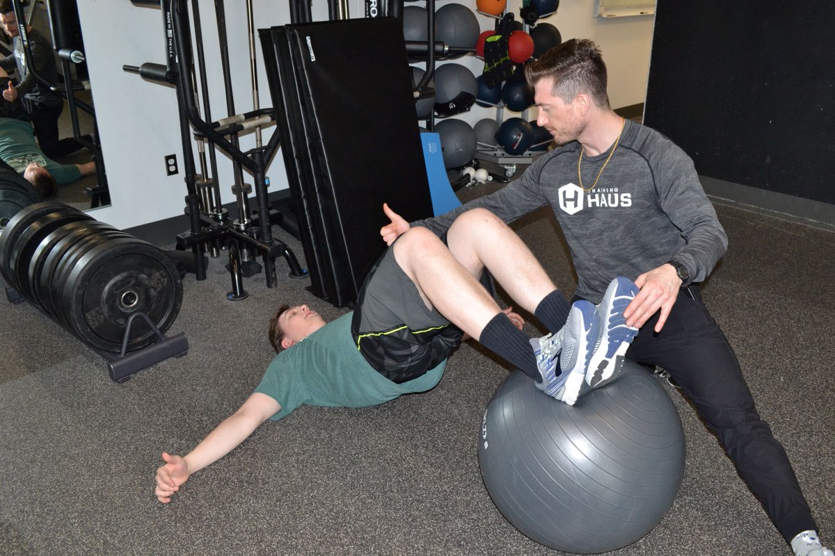 thetrainingHAUS's tweet photo. Core stability plays a big role in providing a base for efficient movement of the legs. Pelvic Tilt Hamstring Curls on an exercise ball is a great way to train hip stability with dynamic muscle action of the hamstrings! #CoreStability #CoreMovement https://t.co/bSrHj0QYS9