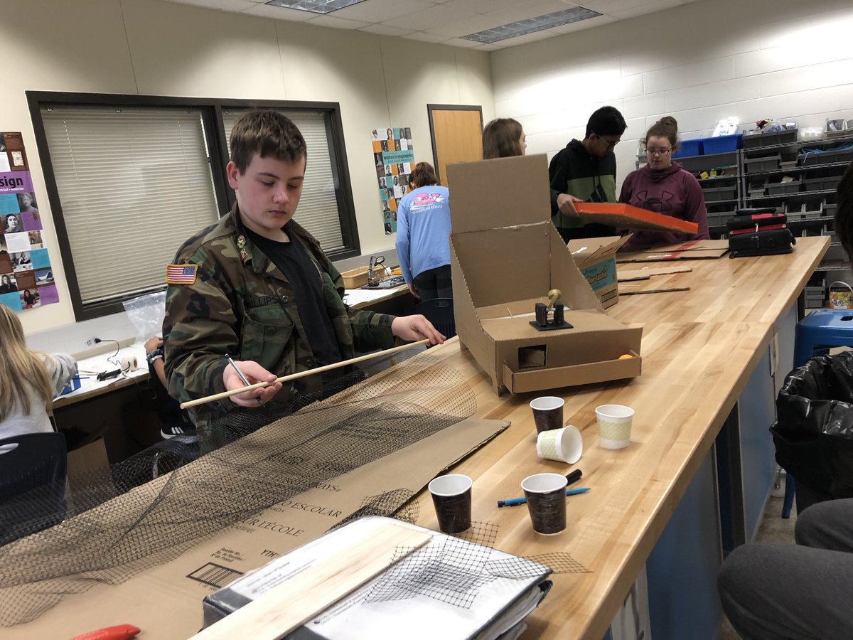 Students working hard to complete their game design projects.