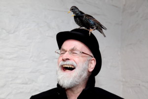 rhipratchett's tweet image. Hard to believe that he's been gone for 5 years. Partly because I carry the-Dad-in-my-head everywhere I go, which means I always have to order Bananana daiquiris whenever see them. This is how I like to remember him - laughing with a bird on his head.