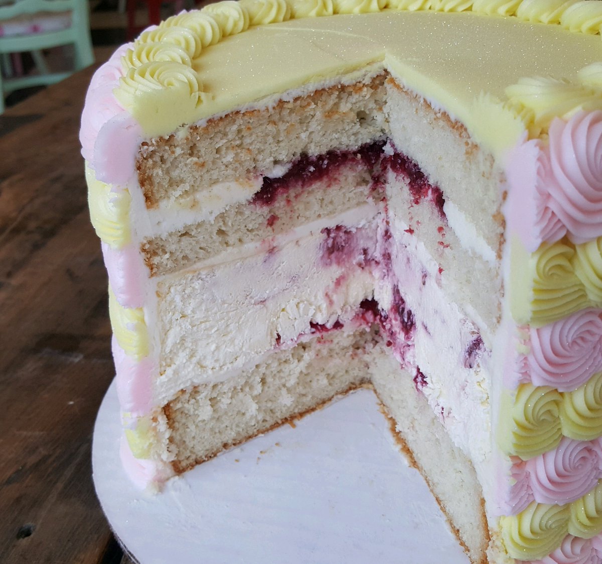 Lemon Raspberry Prosecco Cheesecake 😍 White champagne cake • Raspberry compote • Lemon cream cheese icing • Lemon raspberry cheesecake • Vanilla buttercream rosettes. A popular option available by-the-slice (or a whole cake if you're the 1st to it) some days @ The Lemon Bar!