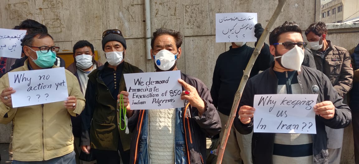 PressTV's tweet photo. Pilgrims from Kargil, #Kashmir remain stranded in #Iran amid #coronavirus outbreak. They have gathered outside Indian embassy in Tehran, demanding evacuation.

#India https://t.co/Ah1VgFZFMq