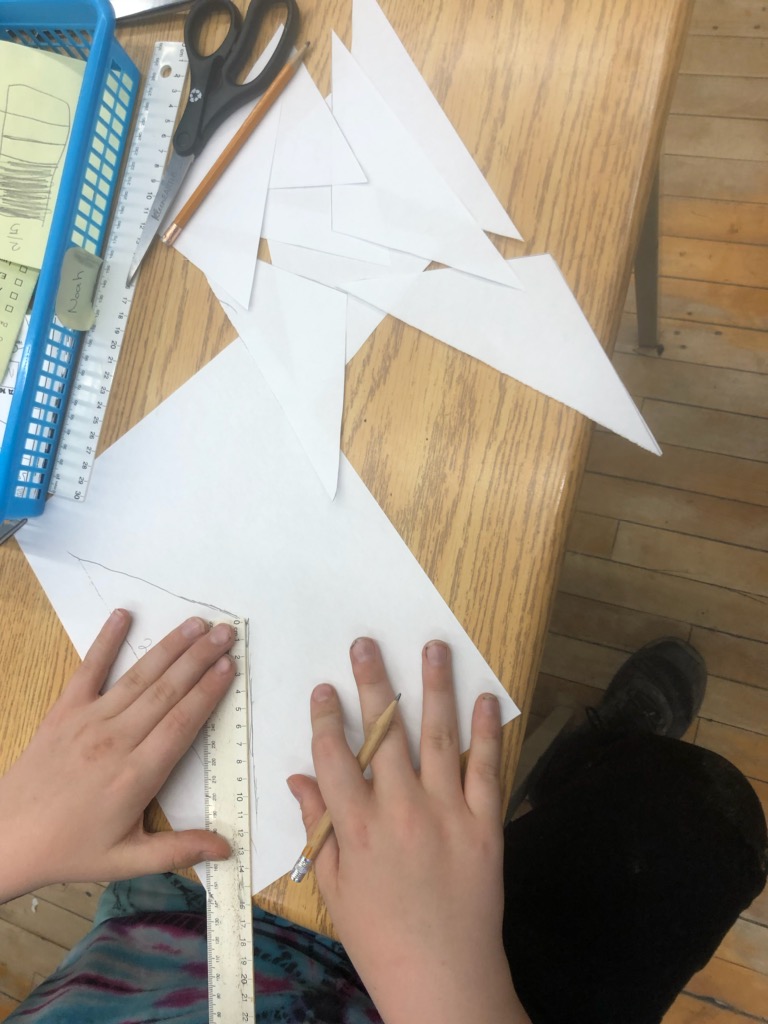 VasiuElena's tweet image. S&apos;s were asked to prove that the picture showed 1/4. Some used their equivalent fractions knowledge, and cut the pieces in half. Some used their prior knowledge of area of triangles. One S measuring the base of one of the triangles. #understandingfractions  #gr6 @Memorial_City