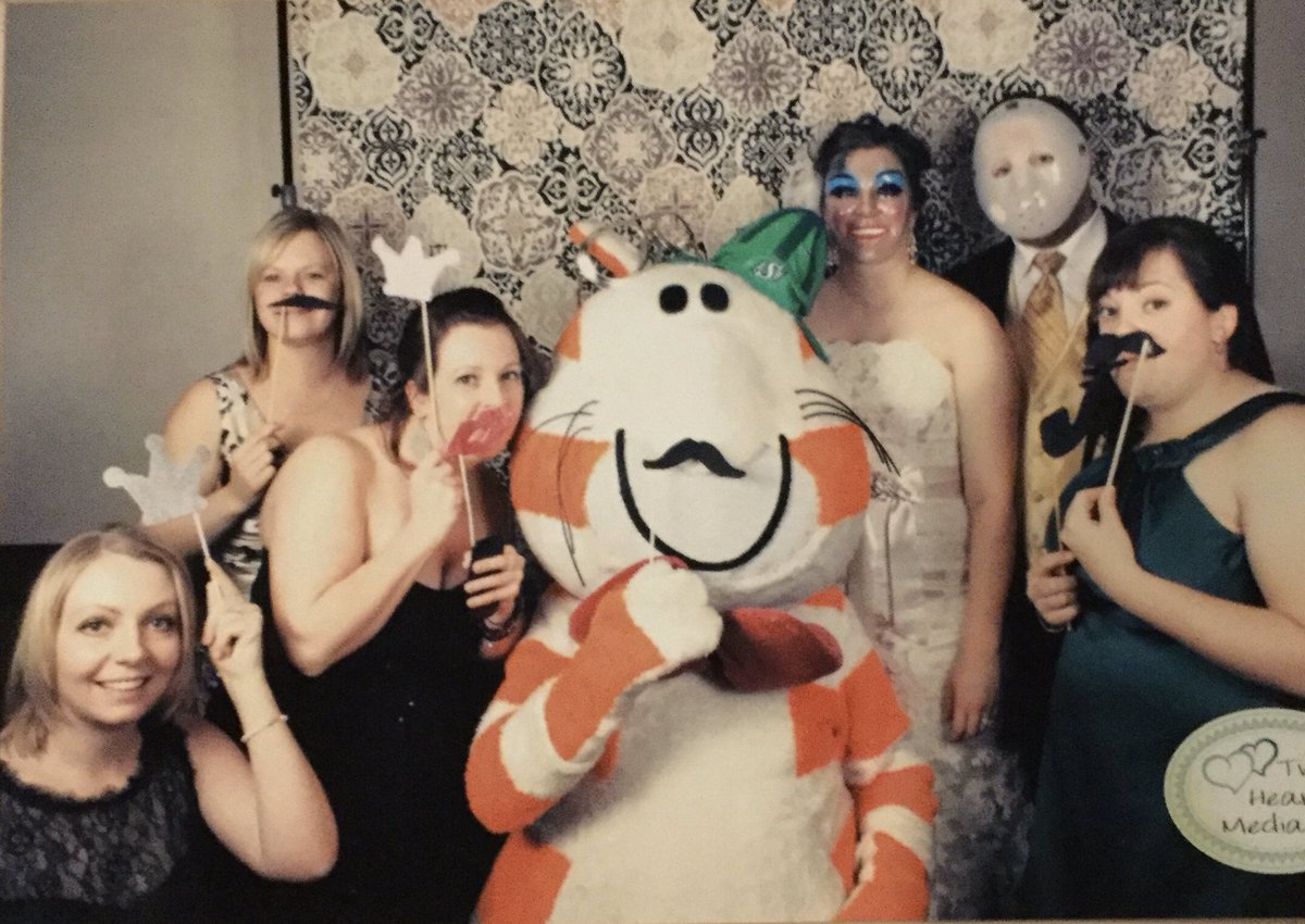 RateFat's tweet photo. This is Fat cat at @alkuchinka’s wedding. She came to congratulate the radiant bride and to try to catch the bouquet. She wore her best bow tie and Roughriders gear.  First ever 15/10 – this is the best thing I’ve ever seen. https://t.co/VBrdn5w5hV