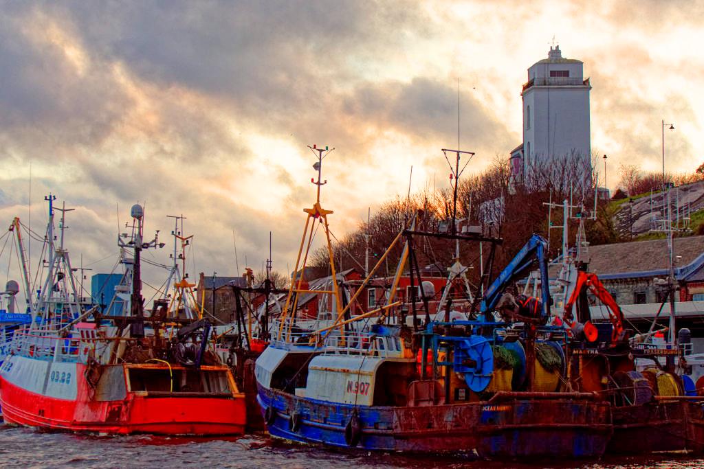 david1hirst's tweet photo. The scene at the Fish Quay #NorthShields this evening. Fishing boats idle because of bad weather and storm clouds a-scudding. An extraordinary day. @StormHour @Old_LowLight #Tyne #weather #MeAtTheQuay https://t.co/mAWSkUmCrE
