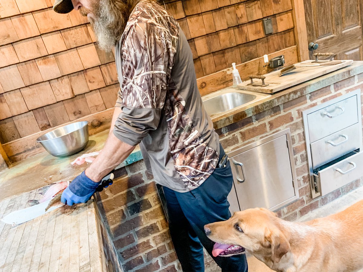 MissyDuckWife's tweet photo. So, while a lot of people panicking due to empty shelves @ the local grocery stores, here I am with a Bible-beating, fishing pole-toting, America-loving, gun-holding redneck who just caught our dinner using his fishing pole and large knife. #GodsGroceryStore #Winning @JaseDuckman https://t.co/1DXGaV2sTj