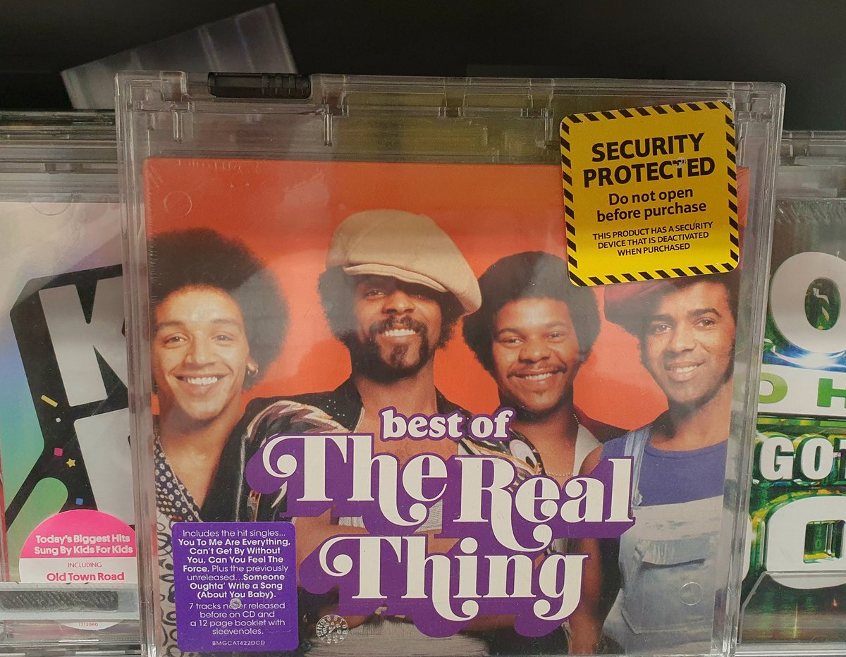 realthinguk's tweet photo. We love seeing our new album #BestOfTheRealThing in the shops. Especially when we are #SecurityProtected. After all, we are priceless!!! New CD out now! https://t.co/QPc3yLkKPZ
