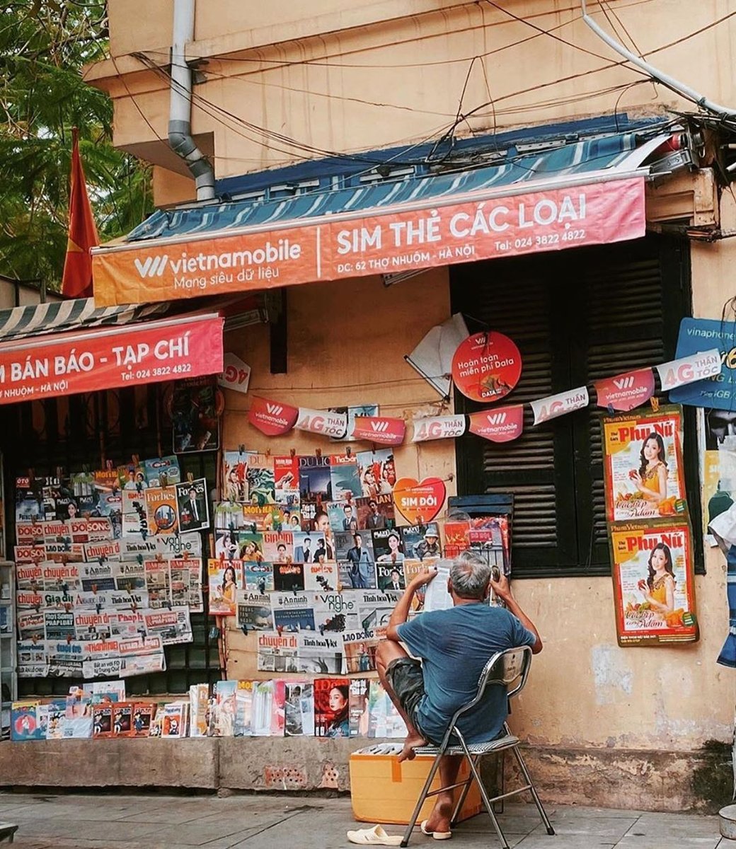 phoandbun's tweet photo. A local man with his newspaper counter in Hanoi.📰
Photo by @ tanduonga https://t.co/NtxkvVU3q0
