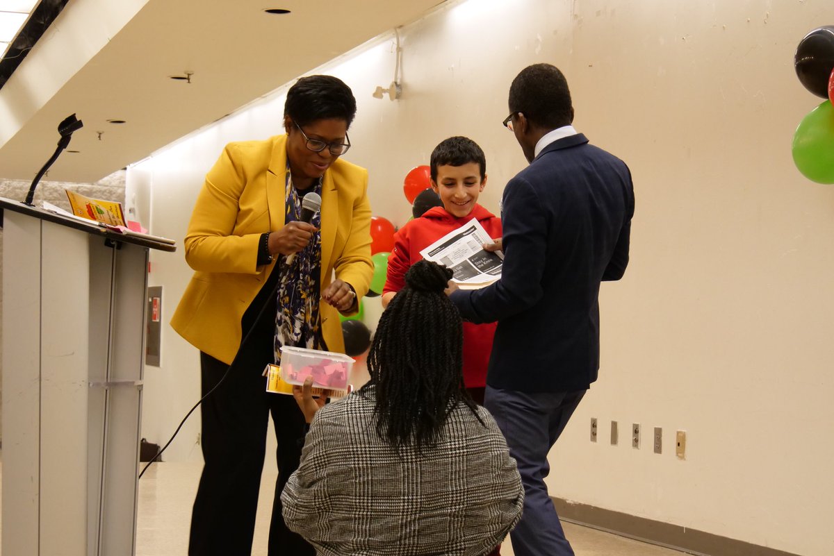 CACD BHM EVENT: Here little Youssef collects one of twelve Raptors 905 tickets to watch the March 21st game.  Here presenting is Harriet Thornhill, VP, RBC and Chris Hayles, MC, 98.7 FM.

Thanks to the Raptors 905, a community leader.