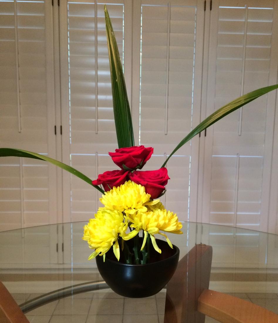 danabelow's tweet image. Sally's #flowers: #Vision of three three's: 3 palm leaves, 3 yellow mums, 3 #red #roses
