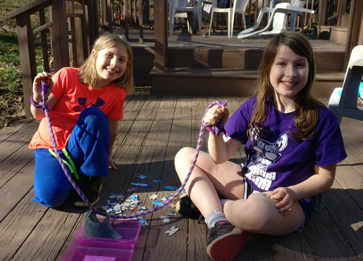The girls are playing backyard Survivor, trying to complete a puzzle challenge while they are each one-handed, tied together with a jump rope. They said Sandra was cheering for them, but she had sat this one out. #WinnersAtWar  @SandraDTwine