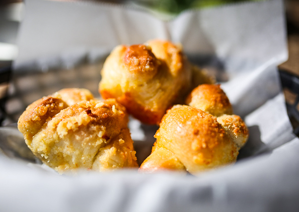 KingsHarbor's tweet photo. “Knot” trying to be dramatic, but these garlic knots from @Zammittis1 are making us drool 🤤 Have you tried them yet?! https://t.co/HgaZOCxIkz