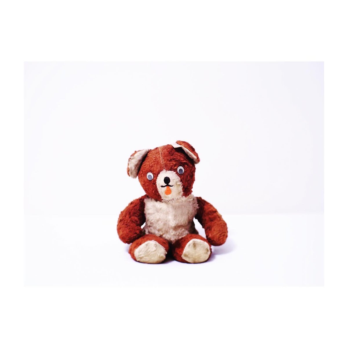 vintage teddy bear with bell in ear