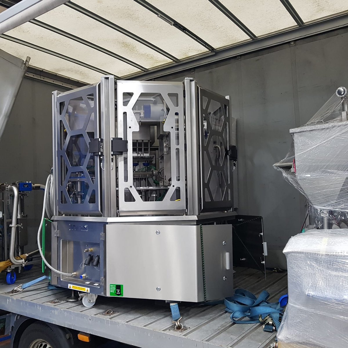 packauto's tweet photo. A Rotofill pot filling machine being loaded to be shipped to a customer for packing a fish pate product in small plastic pots sealed with a plastic film lid #packaging #potfilling https://t.co/2O5bwC08u2