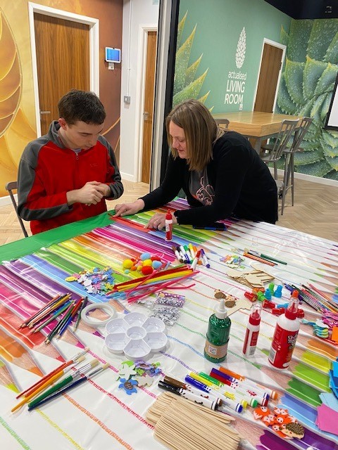 TheSCExchange's tweet photo. Such a great atmosphere in the Social Care Exchange today, with individuals from @HFHC_LTD joining in our #WorldBookDay Bookmark Making Workshop. Lots of paint, glitter and colourful creations! https://t.co/kiZunHFnn3