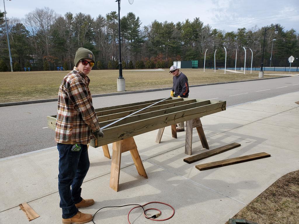 TGreland's tweet image. Carpentry students Aidan and Josh assemble and square frames for our Winslow Street beach access boardwalk #MadeinMarshfield #wesolveproblems