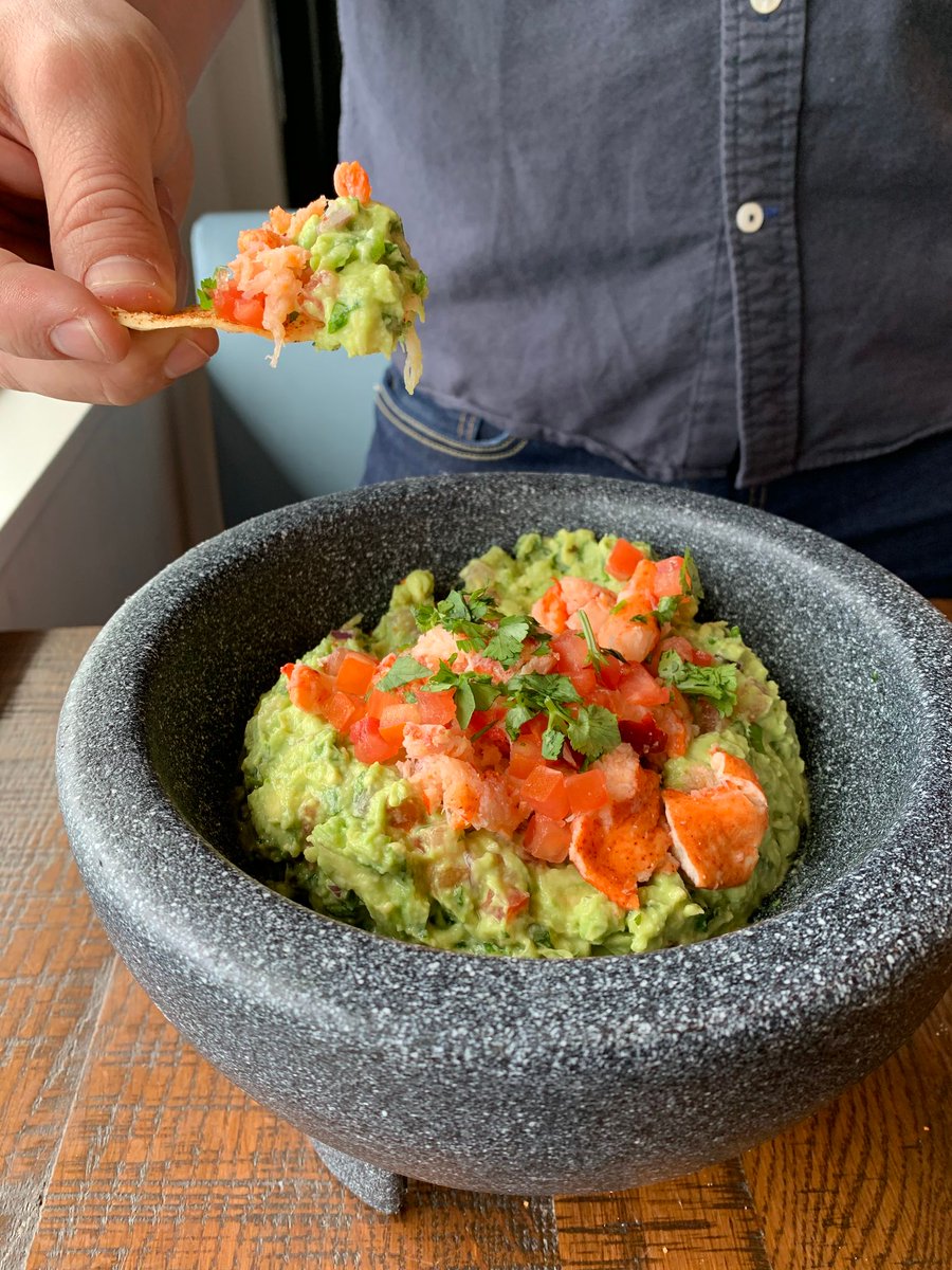 Take a dip into the good stuff! #guacamole #lobster