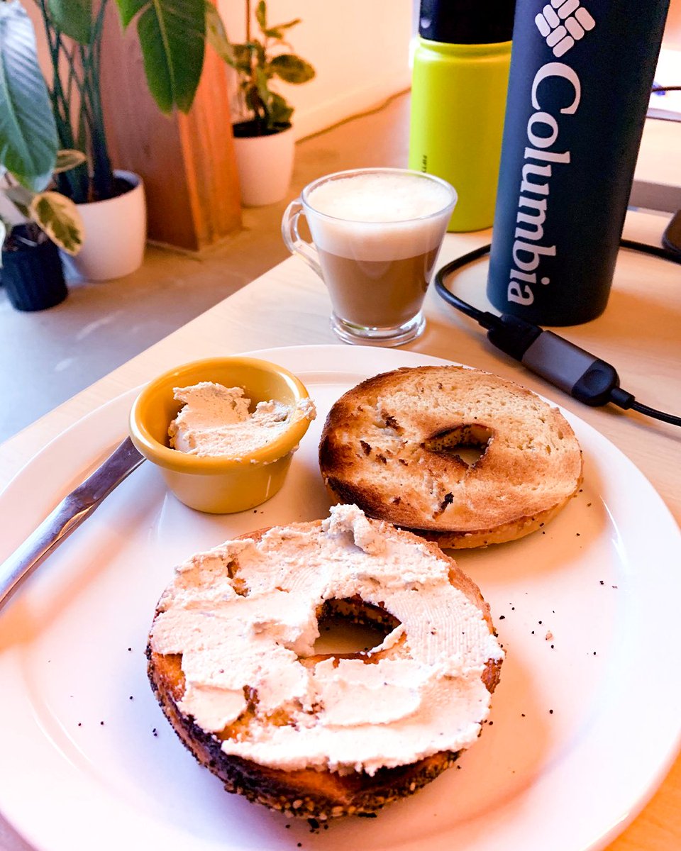 HustleRemotely's tweet photo. #ProductivityFuel: everything bagels, vegan cream cheese, and oat milk cappuccino. PRO TIP: Always keep a water bottle on your desk so you don’t forget to hydrate! #RemoteHustle #Coworking https://t.co/BuwObeKKY5