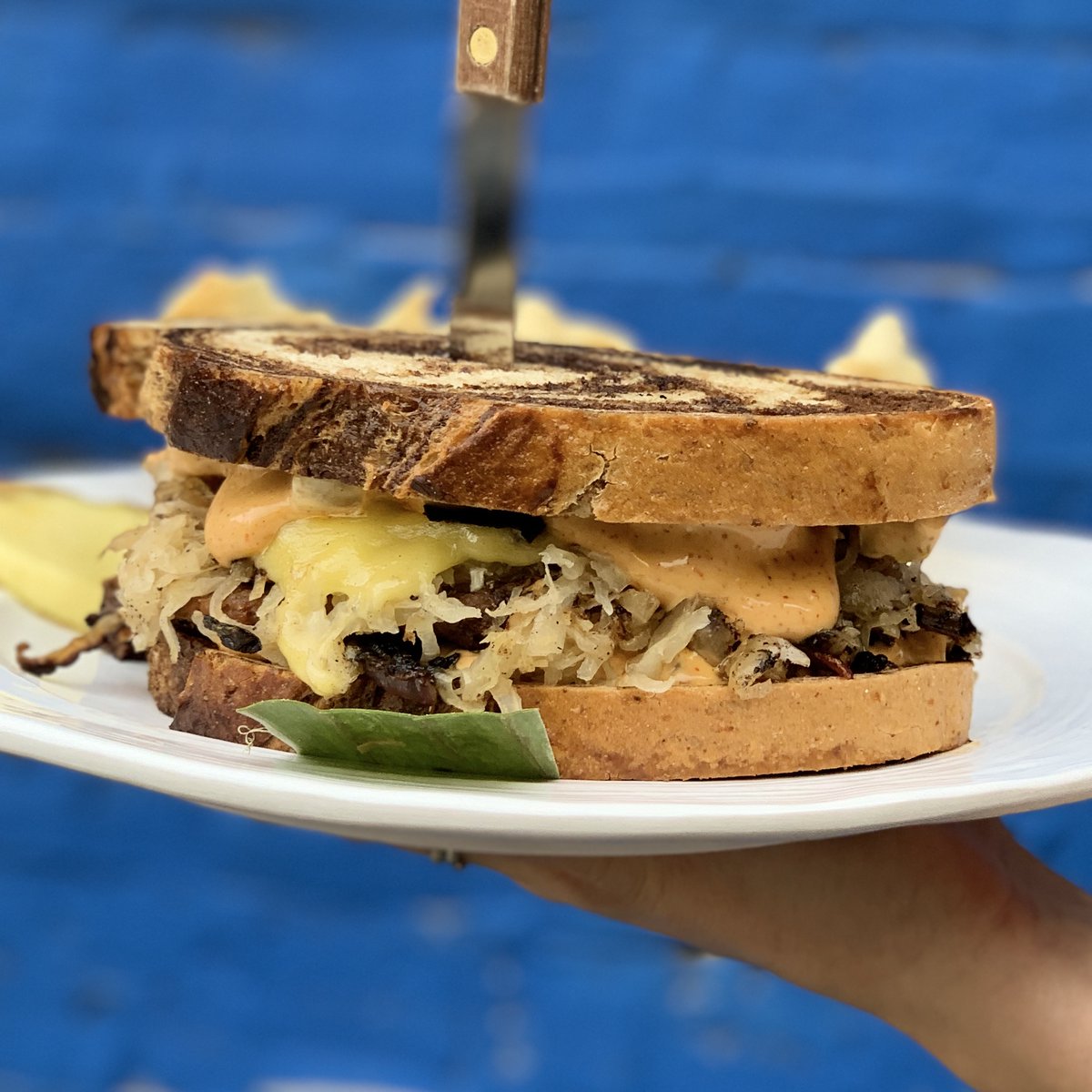 March specials are here 🍀 Say hello to the Reuben Style Burger // a grilled beyond burger patty topped with melted cheese, sauerkraut, grilled onions, and thousand island dressing on toasted rye bread