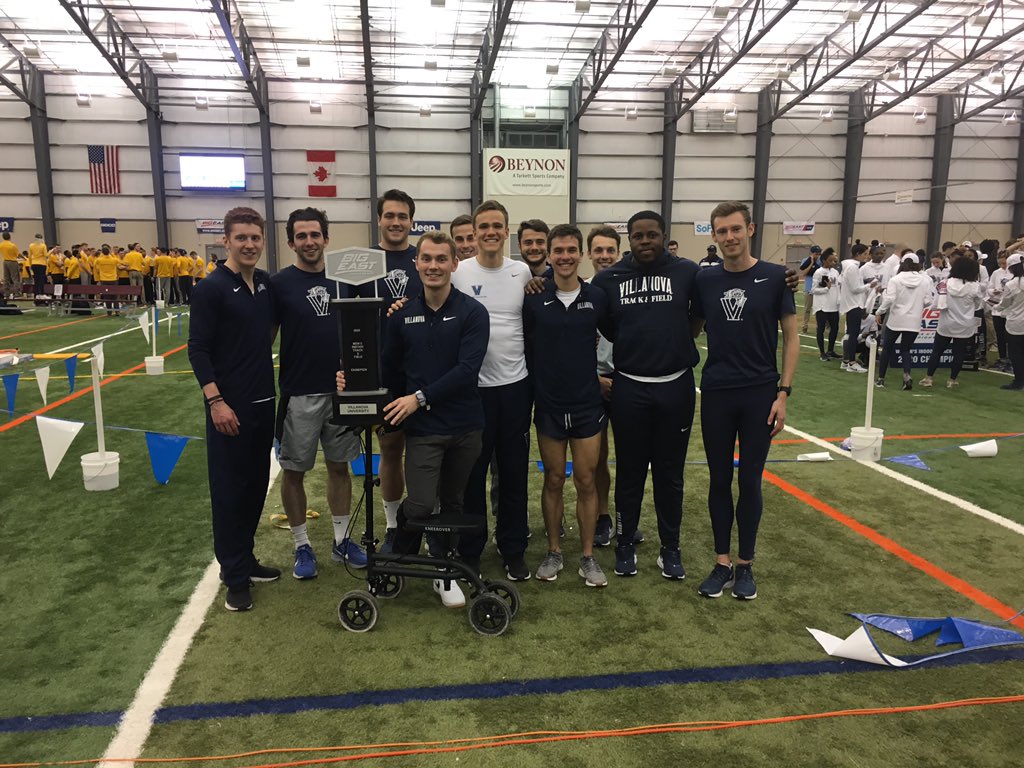 NovaTrackXC's tweet photo. Men’s seniors accepting the championship trophy https://t.co/DyhNNGY8LA