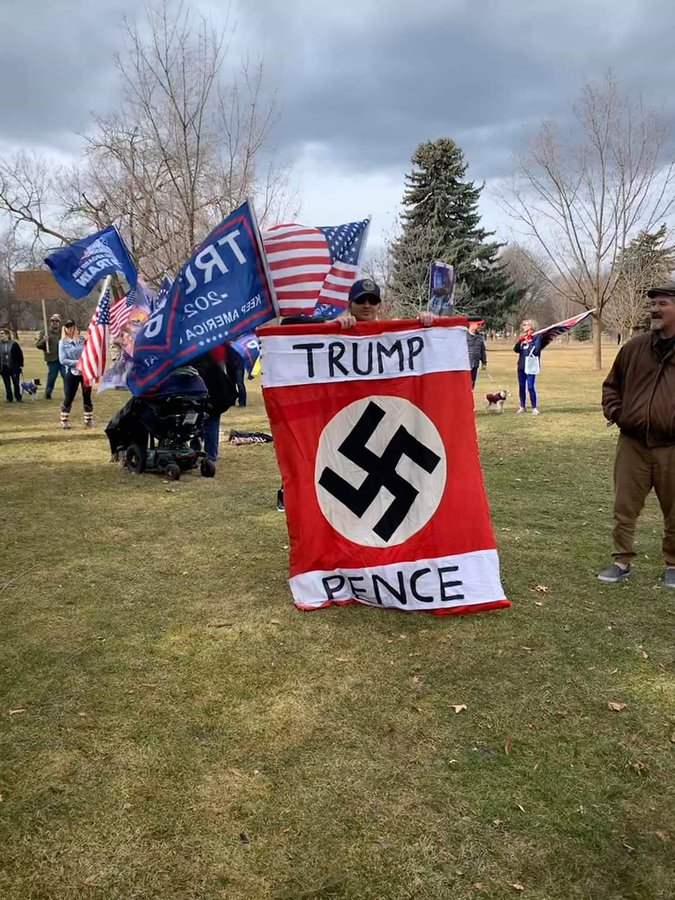 PolitiFact | Trump-swastika-Pence banner photo is not from a COVID-19  protest