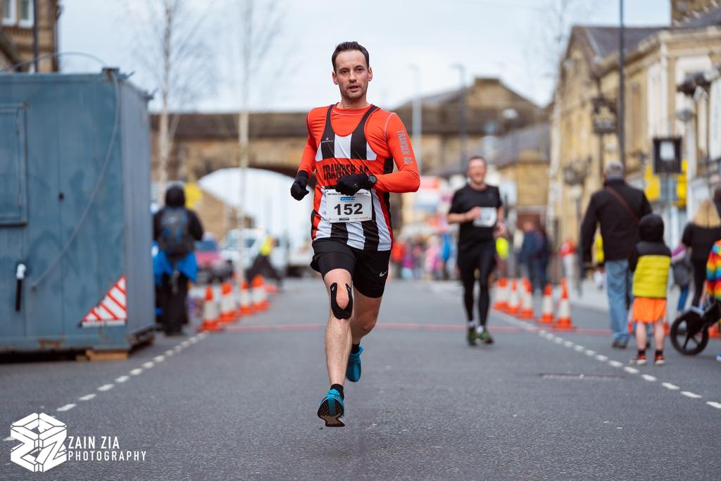 mickhughes75's tweet photo. Flying feet ! ..levitating over the finish in Accrington on Sunday ๐คฃ thanks Zain (images courtesy of Zain Zia Photography). #Zainziaphotography #Ronhillaccrington10k #Cannonballevents #marathontraining #trawdenac https://t.co/r1O7Bu2yQ1