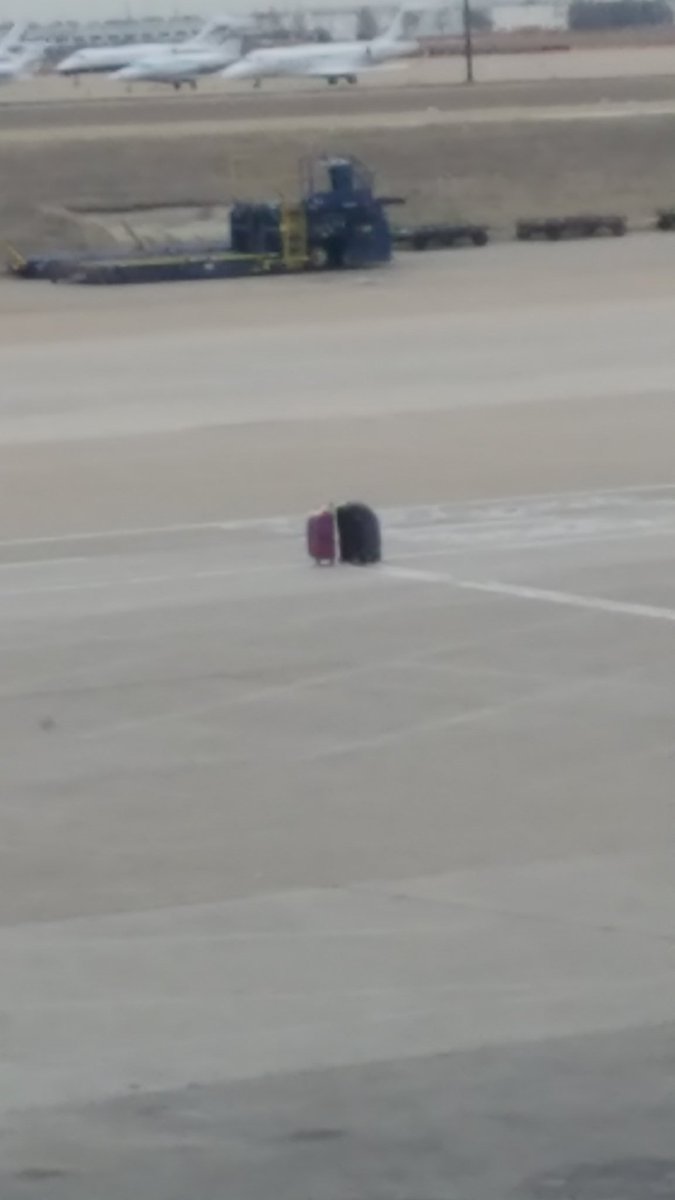 jwsperry's tweet photo. If you've gone through DFW recently and came up short a bag or two, they're still sitting outside gate A10 waiting for you to return. https://t.co/W2fqIU1kMI