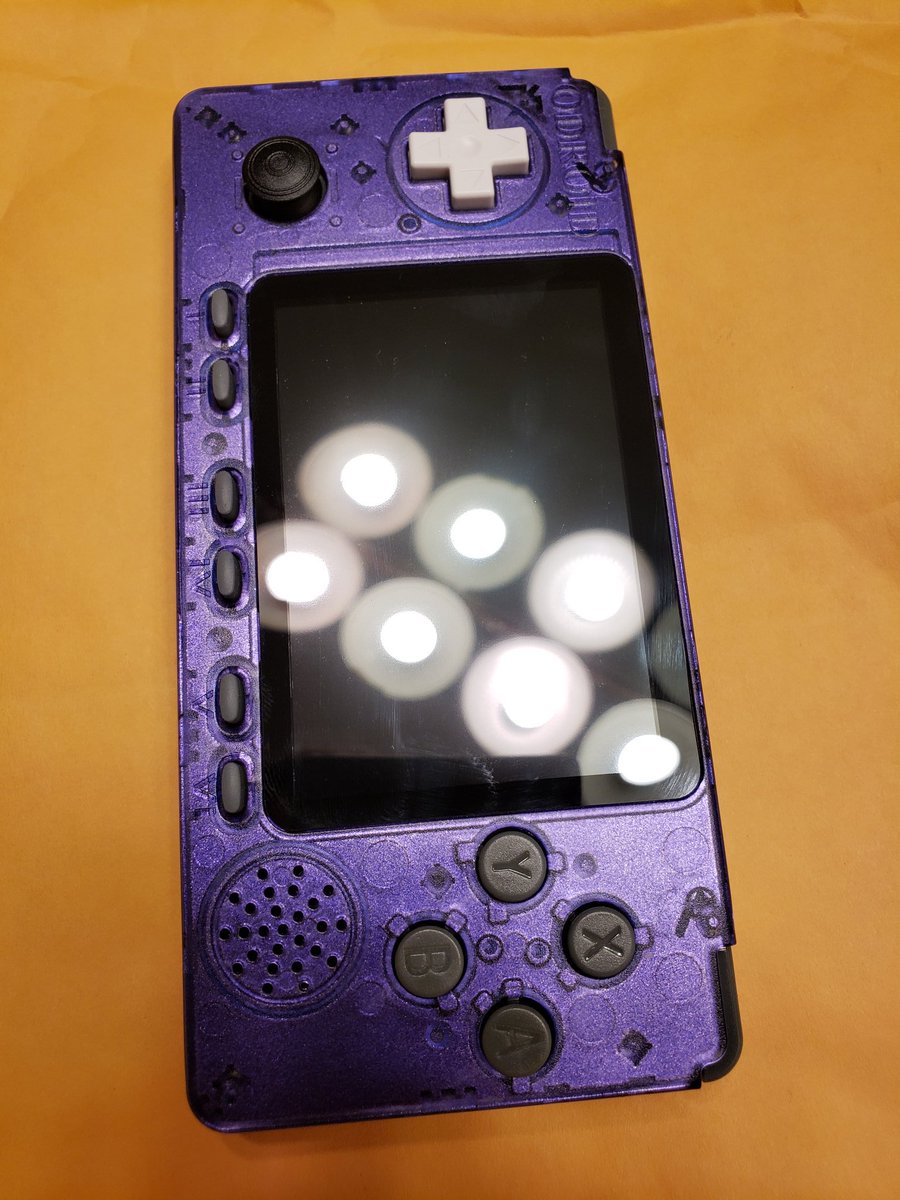 Figment247's tweet photo. My Odroid Go Advance handhelds, finished them both off with Tamiya paint. One is "Metallic Purple" and the other is called "Lame Flake" which changes colors in the light at certain angles.
#odroid #Retro #handheld #games https://t.co/Gf0mhdpp2q