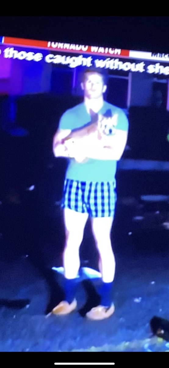 Need to figure out who this guy holding his dog in boxers is after the Nashville tornado so I can buy him beers.