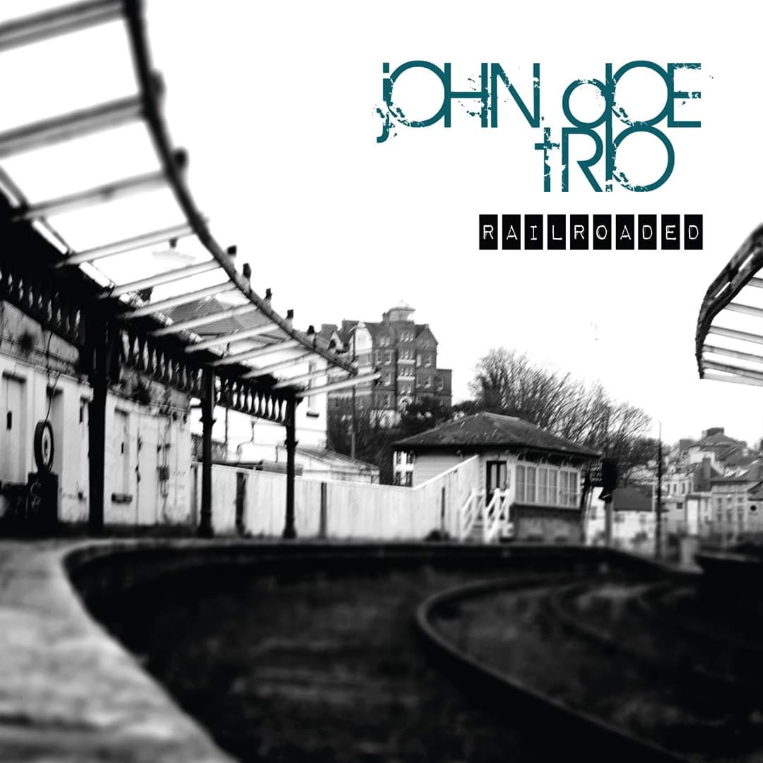 We can now, exclusively, reveal the album art for the new John Doe Trio album, Railroaded. Courtesy of Nicki Komorowski Photography.