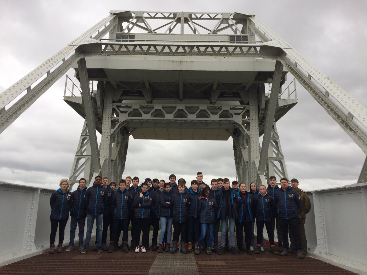 HistoryColfes's tweet photo. Having just returned from Pegasus Bridge, we are loving this image taken of the 6th Airborne Division on 5th June at RAF Harwell... with mascot 'Pegasus' of course! Colourised images continue to help bring D Day to life for our students @TheParachuteReg @ColfesCCF @britisharmy https://t.co/tSowAL4zml