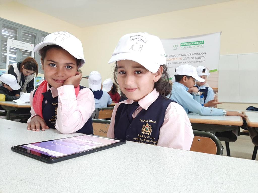Phos_Foundation's tweet photo. Day-5 #DMUV 2nd edition. We are now consulting toddlers from Foum El Oued school in #Laayoune on how to improve their city. They are very happy to be involved in the development of their public spaces. #morocco #urbandevelopment #empoweringcommunities https://t.co/xLOMC7DOsT