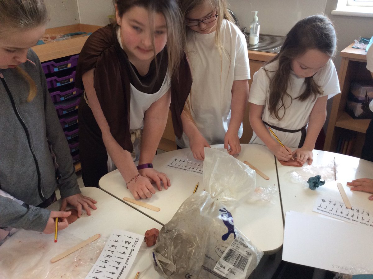 Exploring artefacts, making butter, feeling animal skins and making Viking Runes!