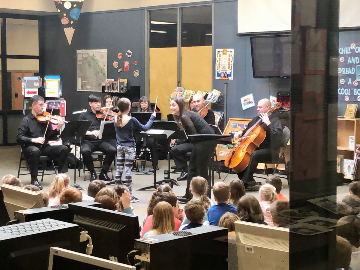 KamSymphony's tweet photo. Music Director Dina Gilbert and KSO musicians in action at some of our #Conducting101 workshops yesterday. Itโs a fun, interactive and educational music experience presented at local schools. Learn more at https://t.co/lnnynqbSwn. #MusicEducation #MusicEducationMatters https://t.co/WxJfe1FwB4
