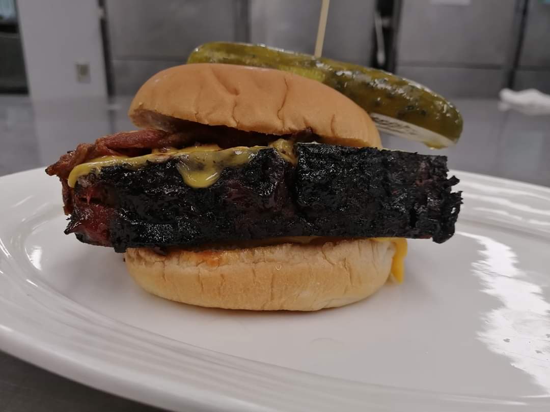 CHEF BILLS' THE M.A.C has arrived.

A thick cut slab of meatloaf, drenched in cheese, topped with maple candied bacon, sautéed onion, pickle and Bill’s secret meatloaf sauce.

The M.A.C is only around until March 7th. Unless it's voted the winning entry into the #YFCBurgerBattle.