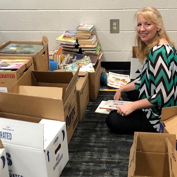 bb_partnership's tweet photo. Winder Elementary School Media Specialist Tammy Privette sorting donated books. You too can give new and gently used children’s books through the Winder Church of Jesus Christ of Latter Day Saints! #donatetoday #reusenotrefuse #beahelper #communitypartners #Barrowlovesbooks … https://t.co/uT4CiK7UTd