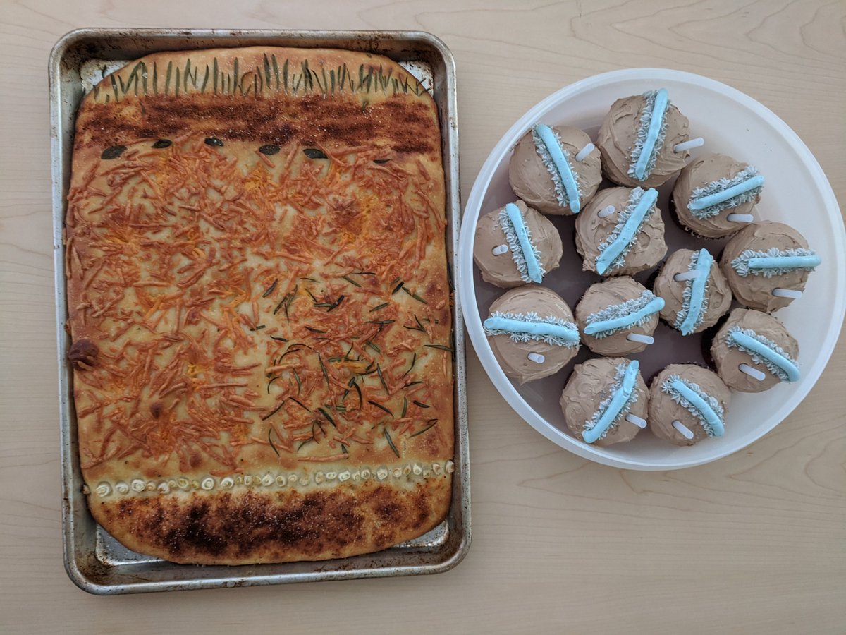 AlissaHCox's tweet photo. My contribution to science: #researchbread and #researchcupcakes ! The cupcakes represent #septicsystemdrainfields with surprise groundwater table elevations! The focaccia represents an experimental layered #nonproprietary passive #Nremoving drainfield. #PhDdefense #researchcake https://t.co/VVZ9XRV9c8