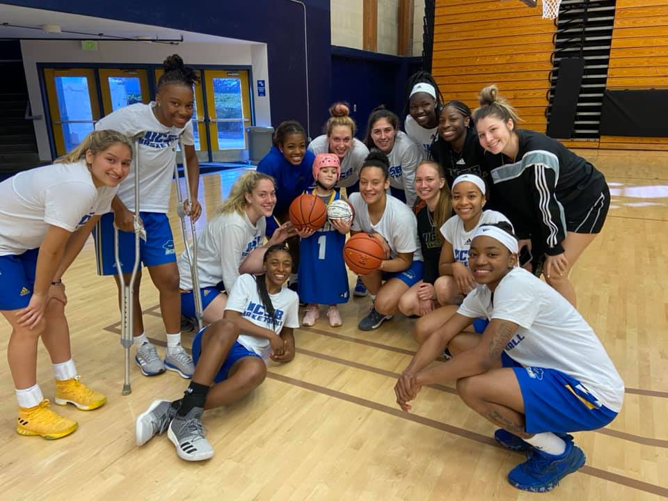 FoJFoundation's tweet photo. Welcome to the FOJ Family, Alanna & @UCSB_WBB! This medulloblastoma warrior signed a team certificate, received gear including her very own jersey (GO #1!) & showed off her basketball skills! A huge thank you to @UCSB_WBB for opening their team & hearts to Alanna & FOJ. #FOJPride https://t.co/XscfU0AjEs