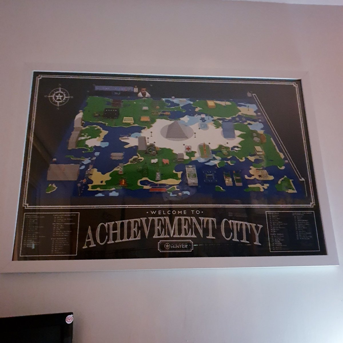 Chelsea_ARogers's tweet photo. @AchievementHunt My boyfriend has had your Achievement City poster for years now (before you updated things) we now finally have it framed and hanging up! Thank you for the joy you bring us with your videos! https://t.co/6nTFXIgcch