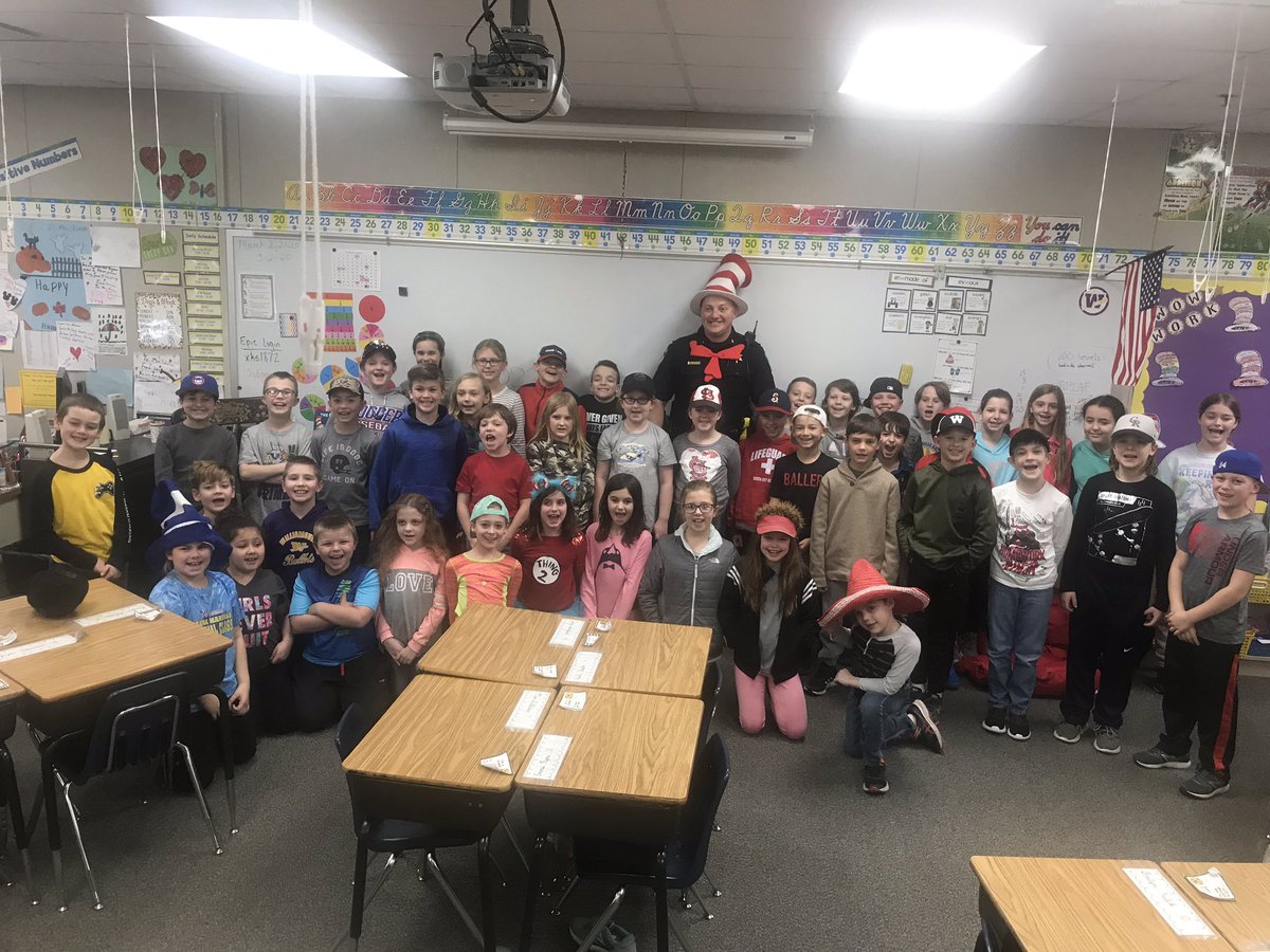 SES_thirdgrade's tweet photo. Dr. Seuss week is off to a great start! Deputy Chief Fulscher stopped by and read “The Cat in the Hat,” and Mrs. Swaney came to our classroom today with some fun Dr. Seuss activities! #connectses #bulletpride https://t.co/y3fkxqZgUJ