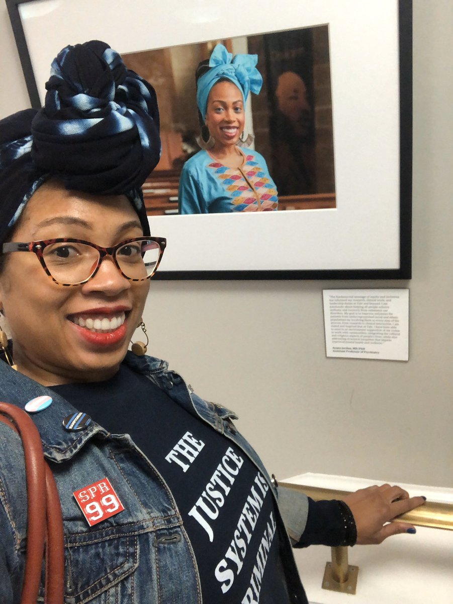 DrAyanaJordan's tweet photo. Was on my way to a #globalmentalhealth talk by two amazing WOC @YalePsych Dr. Nichole Roxas and @AmandaJoyMD and I passed the wall of White men and ran into my Portrait!! Instantly lifted my mood! Thanks @annareisman for your leadership on this project.  #RepresentationMatters https://t.co/7xrVezThaT