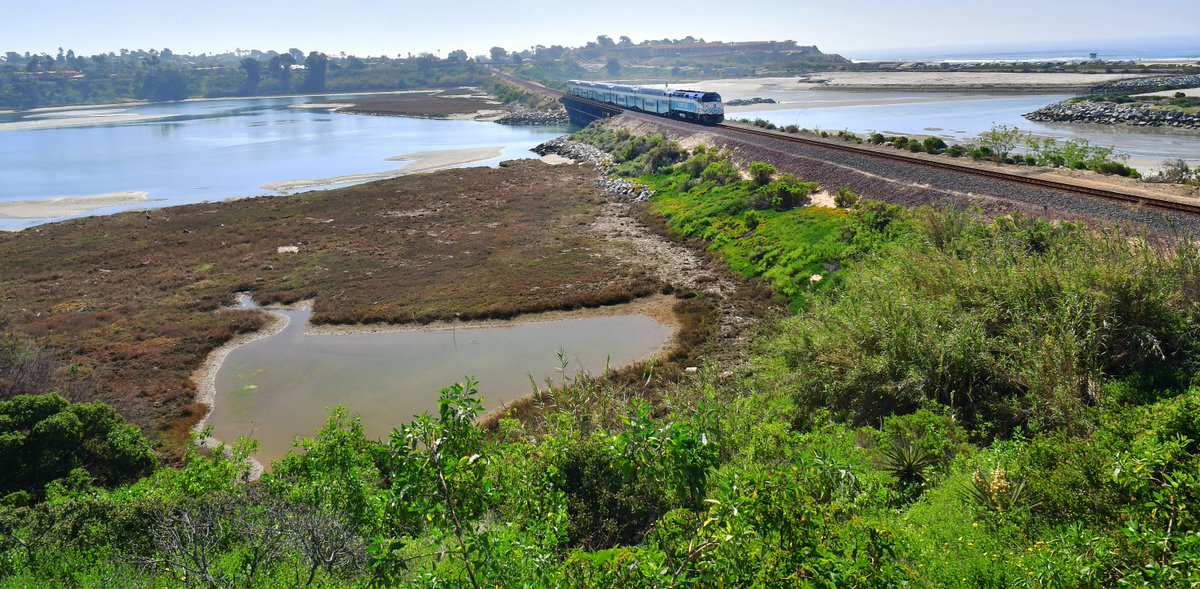 SANDAG's tweet photo. In Feb. @CaliforniaDFW completed dredging of the Batiquitos Lagoon in @carlsbadcagov! Here are a few fun facts about dredging: 
🌊 It increases tidal flow  
🐦🐟 It helps local wildlife thrive 
🏖️ It means more sand on Ponto State Beach 

@BuildNCC @SDCaltrans https://t.co/SO1B2oezZz