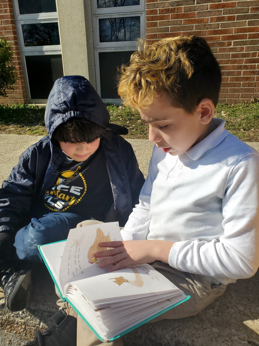 Read Across America the Price way - Fifth Grade reading outside with Kindergarten today.  Leadership, Readership, and Fellowship.  <a href="/PriceOwls/">Price Elementary</a>