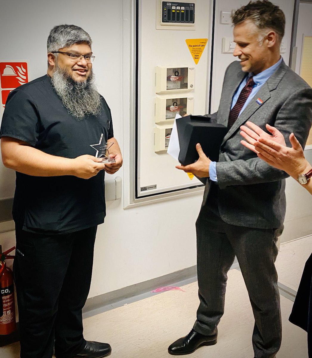 richardpbacon's tweet photo. This is Vic, head of ICU at Lewisham &amp; Greenwich who won the big NHS award at the end of last night. He’s also the consultant who saved my life. He decided not to come to the awards because he was so busy. So I decided to go straight to the hospital afterwards and give him this. https://t.co/DVel6HEnqt