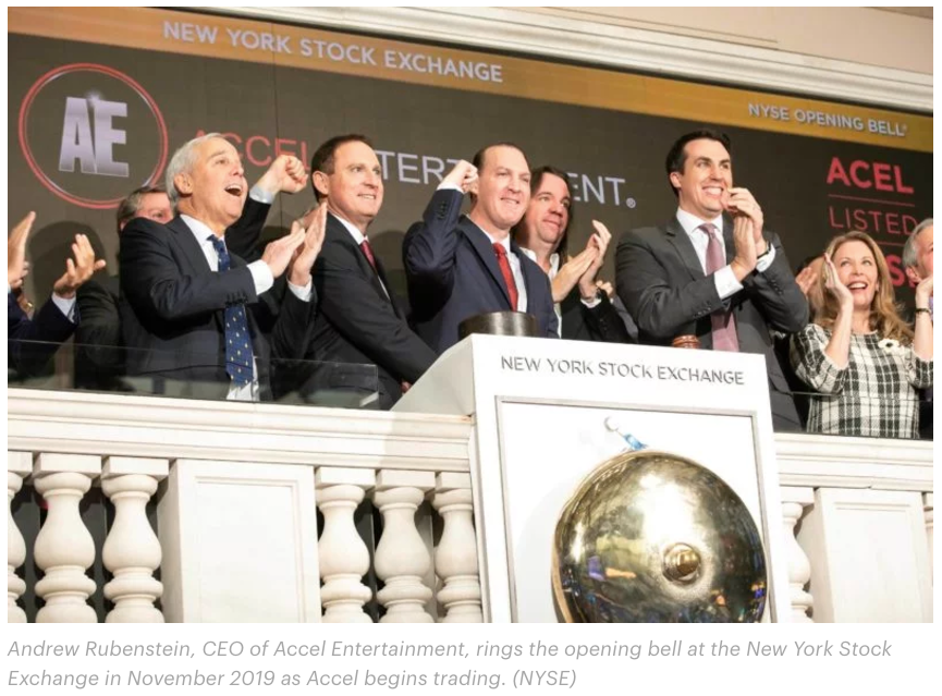 propublica's tweet photo. Here’s a pic of Andrew Rubenstein (middle) as his video gambling company, Accel Entertainment, went public. Accel bills itself as a play-by-the-rules operation that helps small businesses. Emails and thousands of documents we obtained suggest otherwise. https://t.co/ClZg1YaKy5 https://t.co/q4qmojGze1