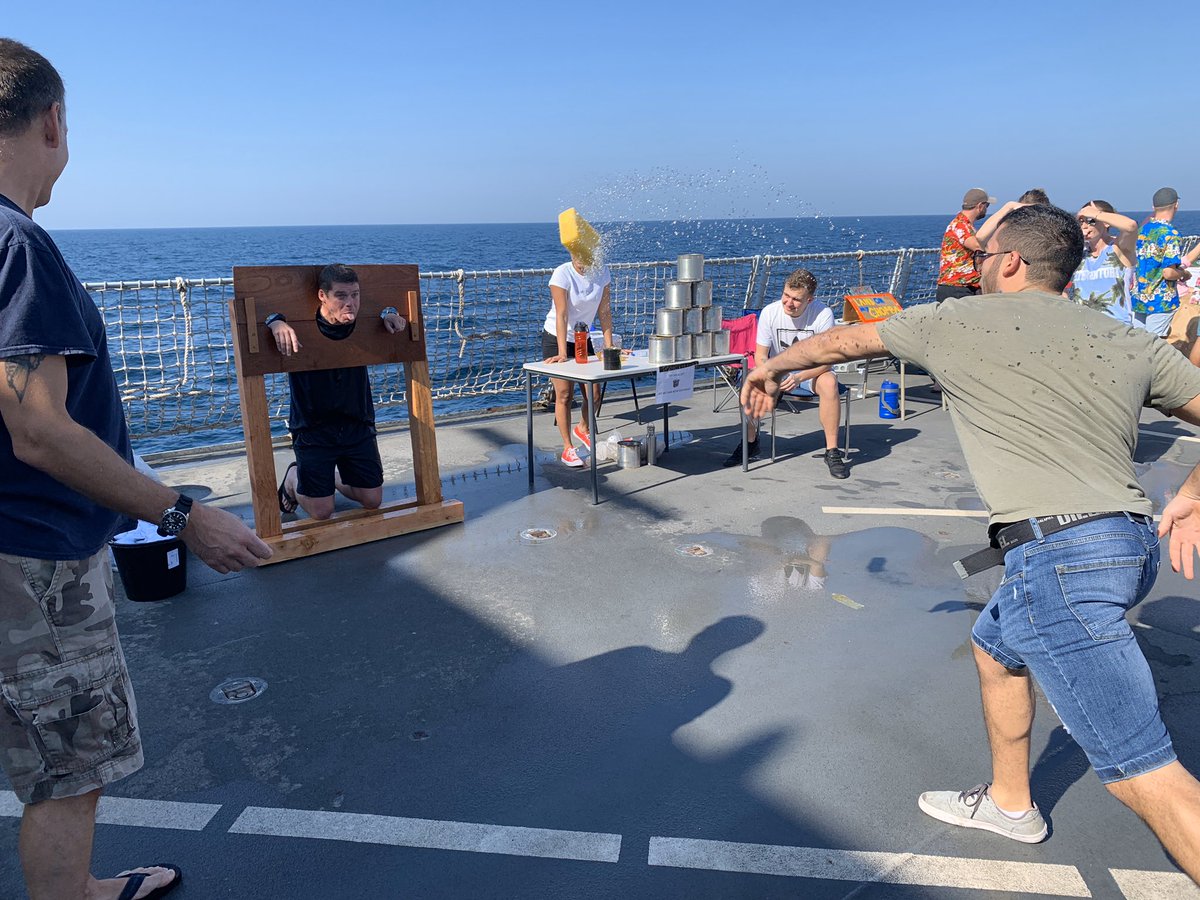 HMSDefender's tweet photo. @HMSDefender ‘s very own village fete! #GetInTheStocks #HumanFruitMachine #FinchysFurlong #StrongMan https://t.co/tUp29Fb9TO