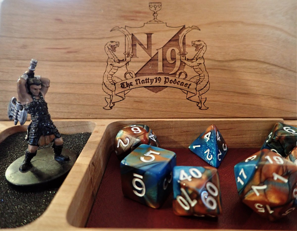 N19podcast's tweet photo. Natty19 is excited to bring you this #ttrpg #giveaway! Follow us and retweet by March 11th for a chancce to win a premium Natty19 Podcast dice box by @Oni_Technology. Bring your #dnd or #pathfinder game to the next level with this high quality "dice char-rier"! https://t.co/dhWpP8y75b