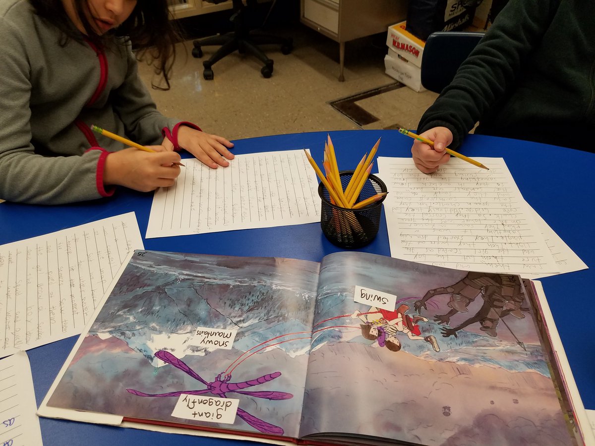 ENLmsA's tweet photo. We've been setting a furiously, fantastic writing pace to put into words what is happening on the pages of this mysterious, magical book. #ENL #creativity #writing #2ndand3rd @Carmelschools @CarmelENL @Kent_Primary https://t.co/UbDpEy26e8
